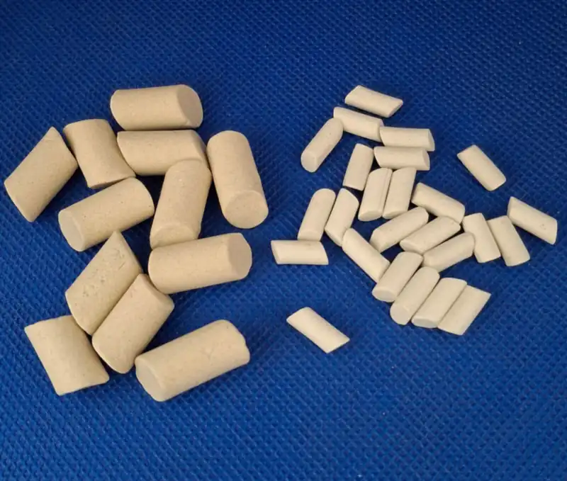 Large 3/8 x 5/8 inch and small 5/32 x 5/16 inch angle-cut ceramic tumbling media cylinders side by side