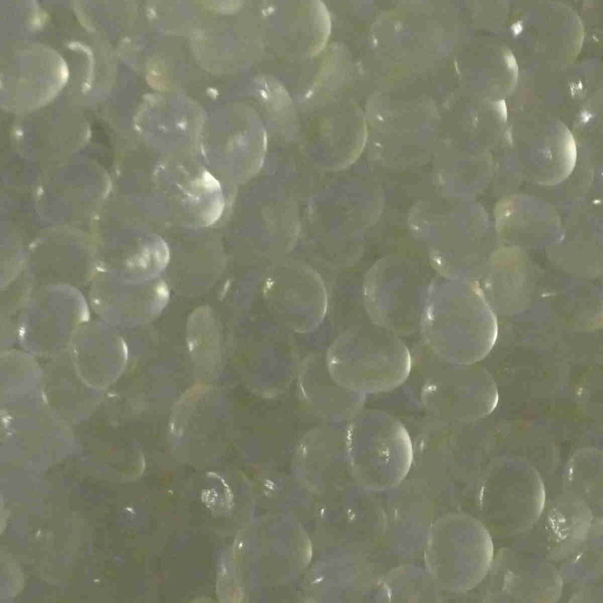 Plastic spacer pellets for cushioning stones in a rock tumbler