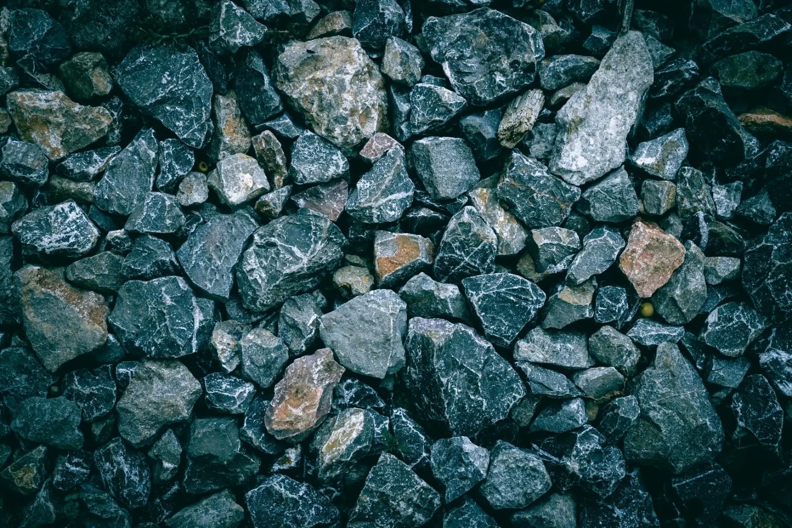 Rough, angular rock pieces ready for the coarse grind in a rotary tumbler