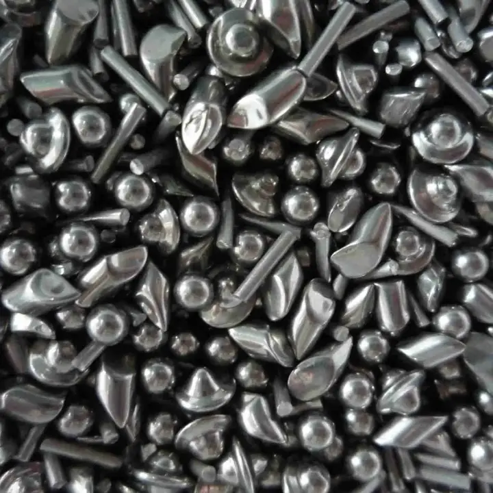 Close-up of stainless steel tumbling shot: angles, balls, cones and pins